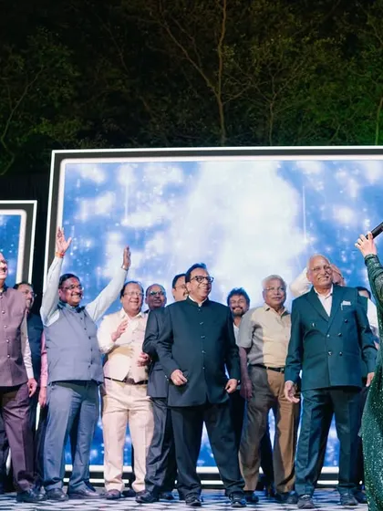 The entire group of gentlemen on stage, celebrating with enthusiasm. It's all about creating a fun, judgment-free zone.