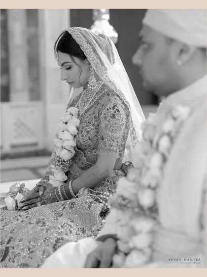 A moment of prayer and reflection during the ceremony. This black and white shot emphasizes the solemnity and spiritual significance of the rituals.