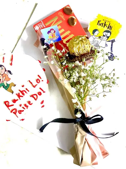 A closer look at our fun "Rakhi Lo, Paise Do" hamper, perfect for the sibling bond.