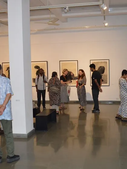 A group of guests enjoying the exhibition 'Quieter than Silence'.