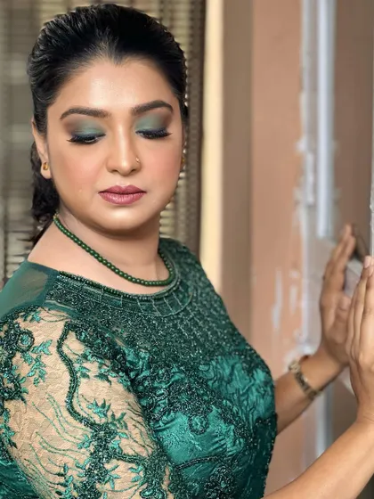 This stunning client is ready for a party with a beautiful green smokey eye that matches her embroidered dress. This look proves that smokey eyes don't always have to be black; using color adds a unique and modern twist.