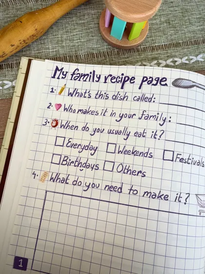 A look inside the 'Cook & Keep' journal. Simple, meaningful questions like "Who makes this dish in your family?" help children connect a recipe to the people and stories behind it.