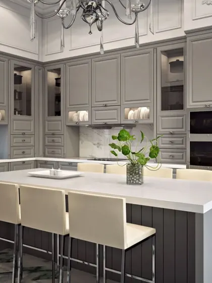 A close-up of the neo-classical kitchen's island and cabinetry, showing detailed millwork and integrated appliances.