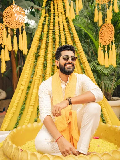 A stylish portrait of the groom during the Haldi ceremony. I make sure to capture individual portraits that reflect the personality and style of both the bride and groom.