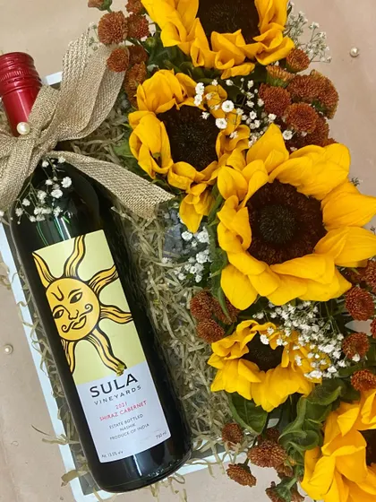 For the wine and sunflower lover, this gift is pure sunshine. A bottle of Sula wine is paired with a bright and cheerful arrangement of fresh sunflowers.