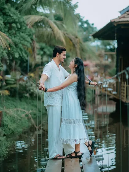 A romantic pose on a rustic rope bridge. This photo of Suchita and Om Prakash, surrounded by water and greenery, feels like a scene from a storybook.