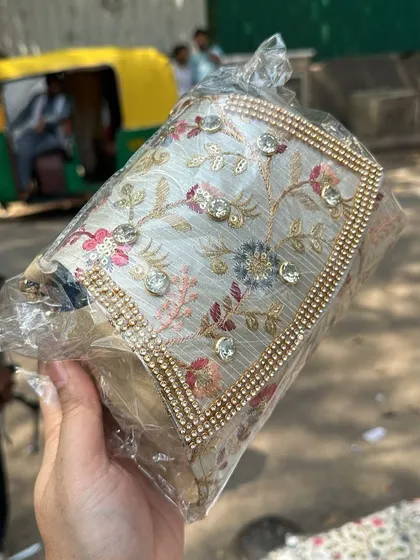 A close up of an embroidered clutch with sequins and rhinestones. The level of detail on these bags is amazing.