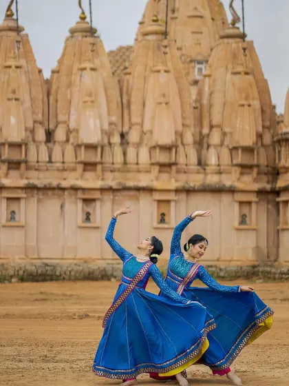 A dynamic turn captured in a still image, showing the energy and control required for Kathak.