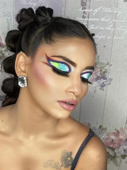 A hi-fashion makeup demo for my students. This look features bold, graphic shapes and a blend of vibrant colors, showcasing advanced techniques and creativity.