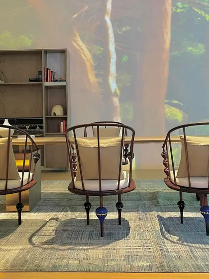 These custom-designed chairs, with their spindle backs and unique, colorful leg details, were a highlight of our exhibition booth. They represent our philosophy of creating furniture that is both functional and a piece of conversational art.