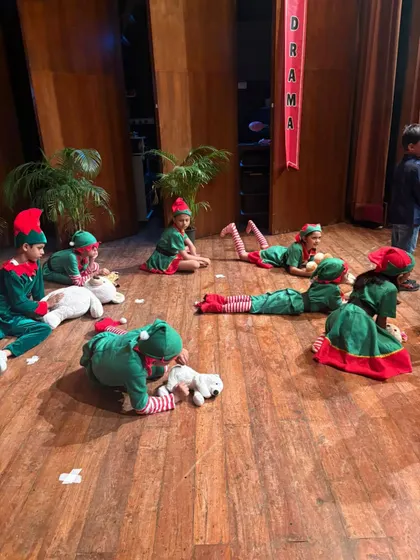 Santa's elves take a break during rehearsals, getting ready for the big Christmas show.