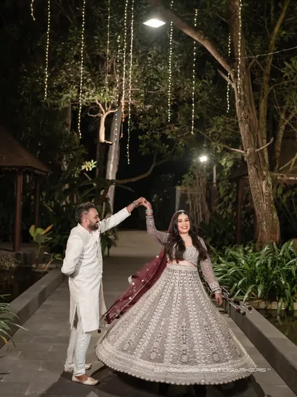 A magical reception dance under a canopy of fairy lights. This shot captures the romance and celebration of the evening, creating a fairytale-like memory.