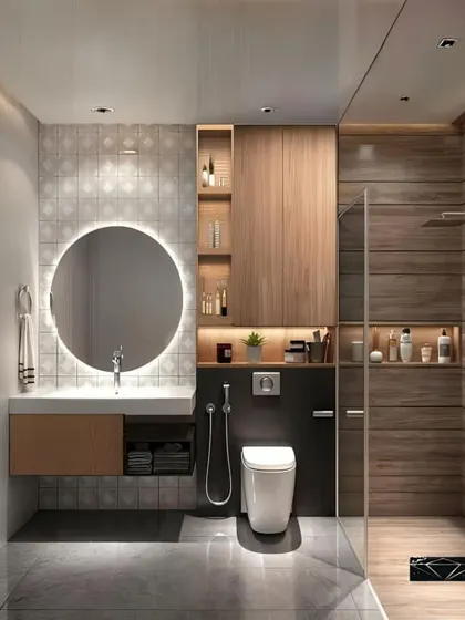 This bathroom has a warm, spa-like feel with its wood-paneled shower and floor. The round backlit mirror and floating vanity are modern touches that complete the look.