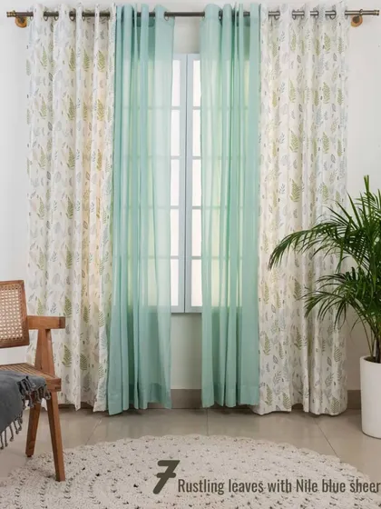 Our Rustling Leaves print is paired with a solid Nile Blue sheer. The combination of a nature-inspired pattern with a soft, solid color creates a refreshing and tranquil atmosphere.