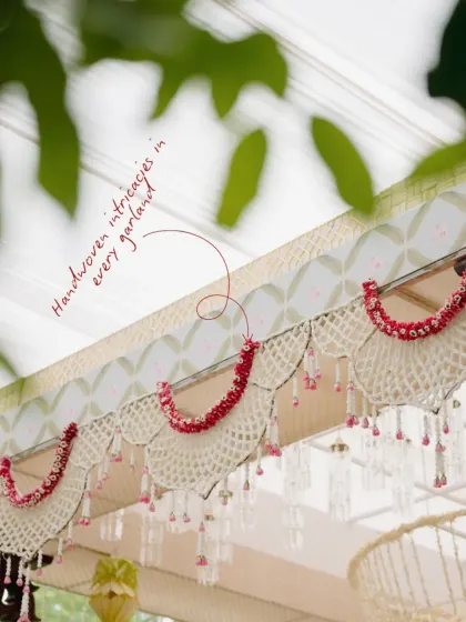 Every garland in the 'Pastel Panchangam' theme is handwoven with intricate detail. This close-up shows the delicate craftsmanship that goes into creating these beautiful floral elements.
