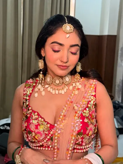 A close-up of Neha's Haldi eye makeup. The monochromatic pink look is modern and perfect for a fun, daytime event.