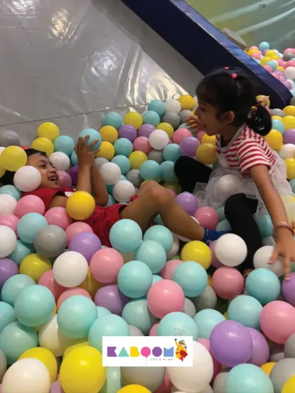 The ball pit is a place for playful moments and making new friends.