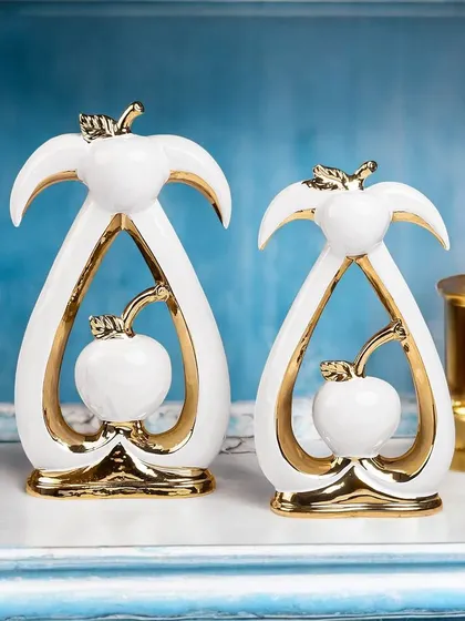 Part of my black and white series, this abstract showpiece in white and gold is a modern interpretation of apples. The clean lines and metallic accents make it a chic and sophisticated decor item.
