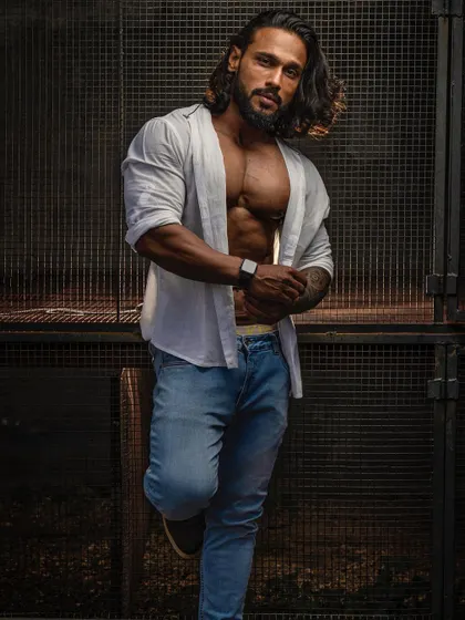 An urban photoshoot look that combines a strong physique with modern style. I believe in a holistic approach where your physical fitness enhances your personal presence.