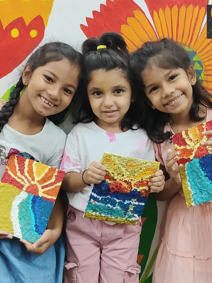 So much joy and pride in their finished work. These girls created stunning sunset seascapes using paper mache, learning about texture and color blending along the way.