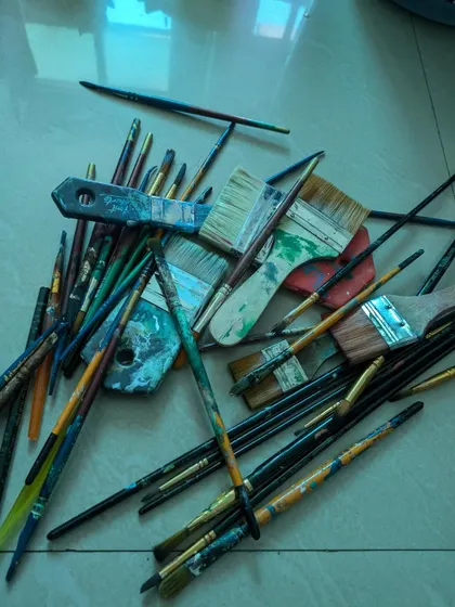 My brushes, all used and loved. This pile of creative mess is where my ideas live.