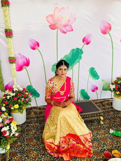 A wider shot showing the beautiful floral decor for the Pellikuthuru function. The bride's fresh and radiant makeup.