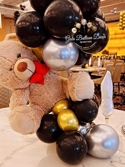 A teddy bear centerpiece for a glam party, showing how this classic element can be adapted for different styles.