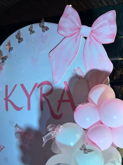 The oversized pink bow prop is the perfect statement piece for this adorable and stylish half-birthday party.