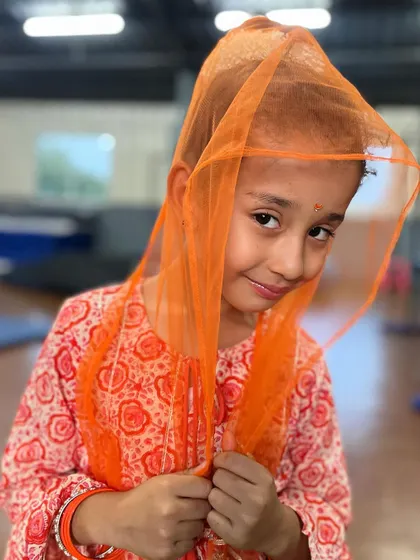 A sweet and gentle smile. Our dress-up days allow kids to explore different characters and express themselves.