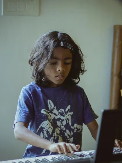 A young pianist playing with a maturity beyond his years. We nurture talent at every age.