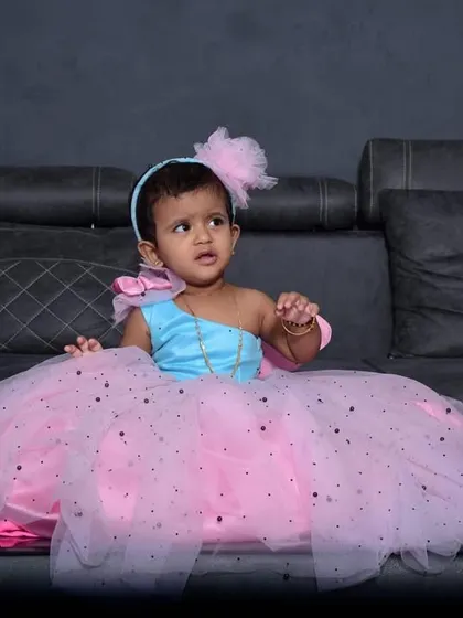 Another shot of the little princess in her beautiful party frock, complete with a matching headband.