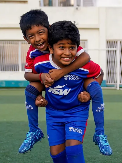The bonds of friendship are forged on the training ground. A piggyback ride between two friends captures the fun spirit of our camps.