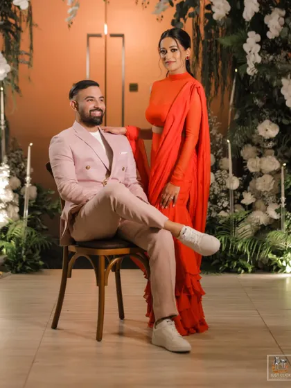 A stylish portrait of the couple at their engagement or welcome dinner in Thailand.