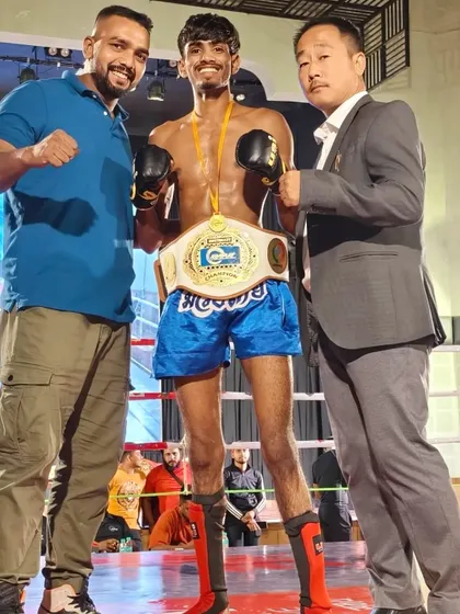 Posing with the champion and an official. This title belt is the result of a perfectly executed fight camp and strategy.