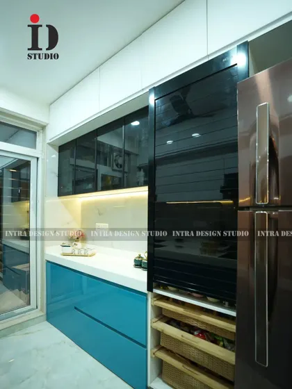 Smart storage solutions are essential. This image shows a pull-out pantry unit with wicker baskets next to the refrigerator, making it easy to organize and access groceries in this compact parallel kitchen.