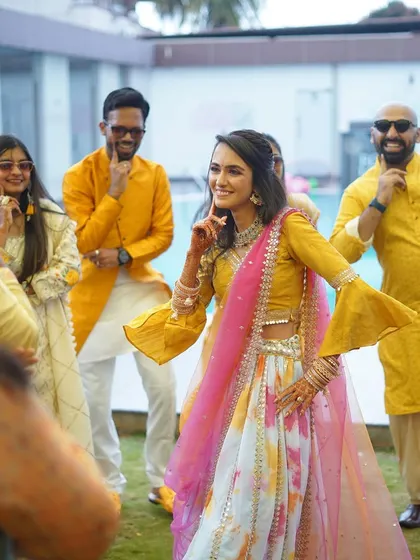 A surprise flashmob at a Haldi ceremony, full of fun and color.
