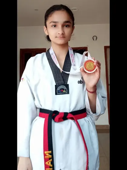 A student with her silver medal from the 38th Delhi State Junior Taekwondo Championship.