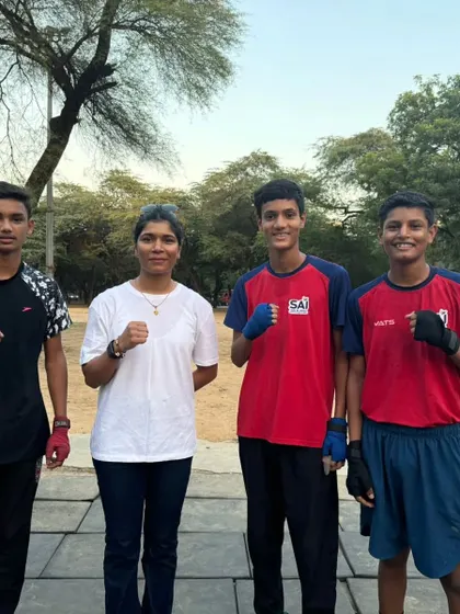 Our coach with a group of young, determined trainees. We believe in building a strong foundation and a sense of teamwork from day one.