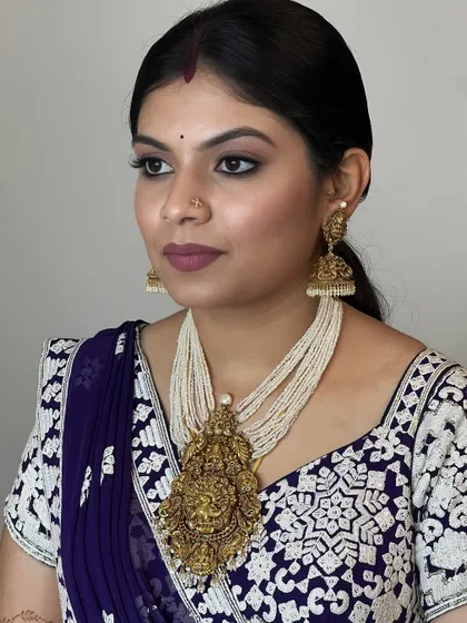 This profile shot highlights the clean lines of the eyeliner and the smooth finish of the skin. Precision is a skill that I emphasize and help my students to develop.