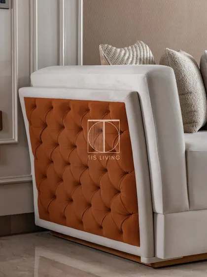 The difference is in the details. This side-layer quilting on one of our custom sofas is a small touch that adds immense texture and refinement, transforming a simple silhouette into a piece of understated luxury. This is the level of detail we bring to every item we craft.