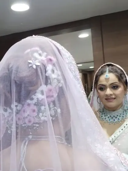 Another angle showing the placement of the flowers and the veil. The hairstyle is designed to be beautiful from every viewpoint.