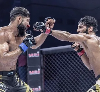 A brutal exchange during Sanjeet Budhwar's five-round title defense at MFN 13. This image captures the grit and toughness required to be a champion.