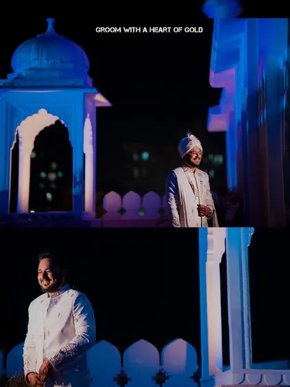 A portrait of the groom looking regal against a backdrop of traditional Rajasthani architecture at night. The blue lighting adds a cool, cinematic feel to this "Groom with a Heart of Gold."