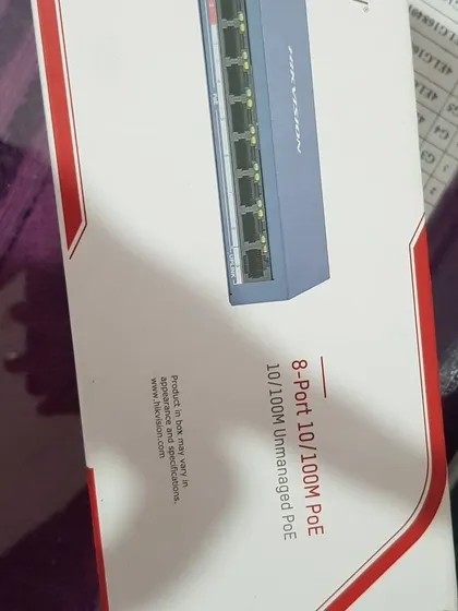 A Hikvision 8-Port PoE (Power over Ethernet) switch, used to power IP cameras through the network cable.