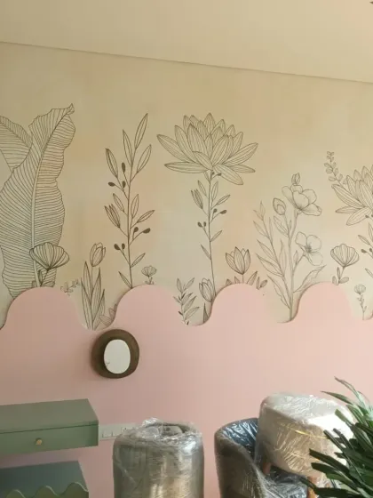 A unique wallpaper combining a solid pink wavy border with a delicate floral line drawing on top.