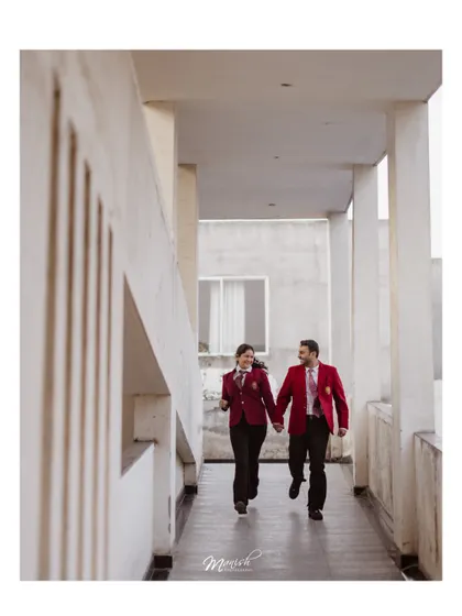 A candid shot of the couple running through the school hallway, full of energy and happiness, celebrating their journey from classmates to soulmates.