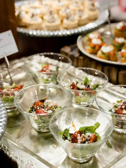 Mini salad bowls served at the Gazal Gupta event. These individual portions of fresh salad were a light and elegant addition to the grazing table.