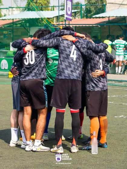 A team huddle before a crucial match, a classic display of unity and shared purpose. We create an environment where colleagues become a cohesive squad.