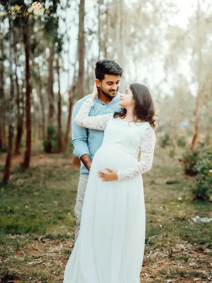 The soft, natural light in this wooded location is perfect for creating romantic and dreamy maternity portraits for couples.