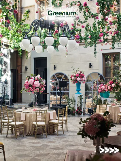 An elegant rooftop design perfect for a special event or a luxury restaurant. The space is filled with beautiful pink and white flower arrangements and classic furniture.
